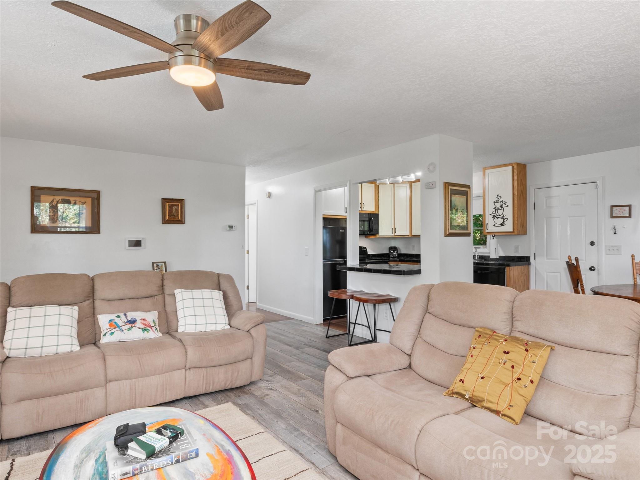 290 Turkey Pen Road Franklin, NC 28734 - Photo 11 of 37 a living room with furniture and a view of kitchen