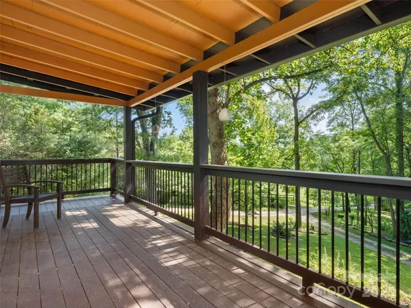 a view of balcony with wooden floor