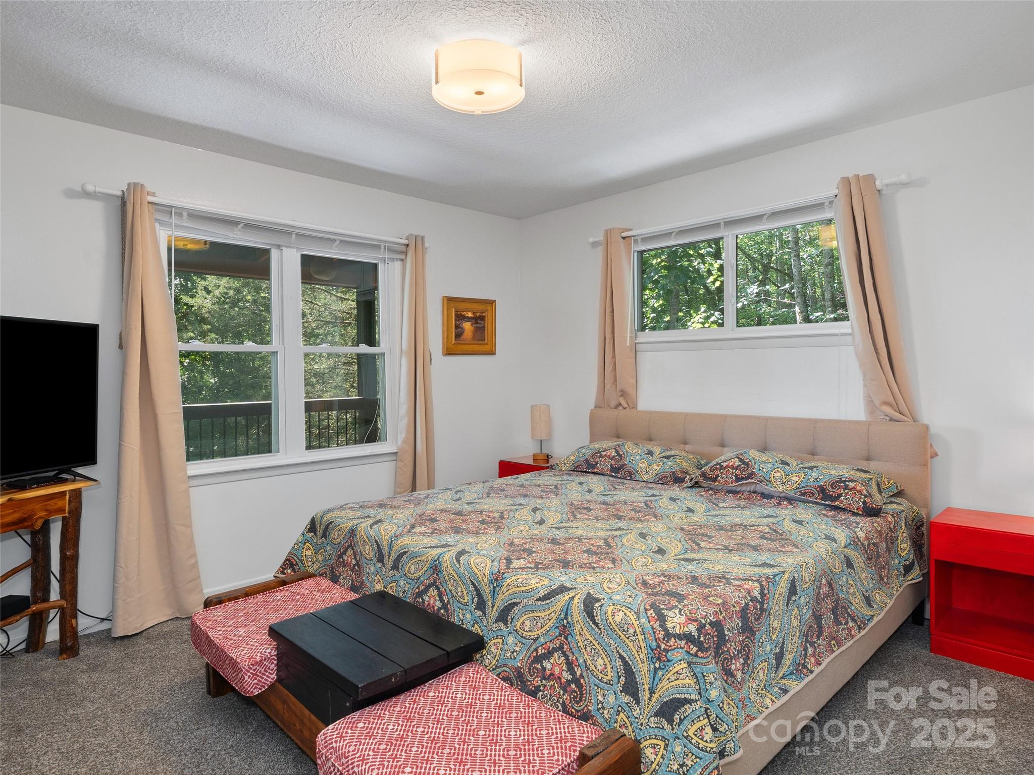 290 Turkey Pen Road Franklin, NC 28734 - Photo 19 of 37 a bedroom with a bed and a window