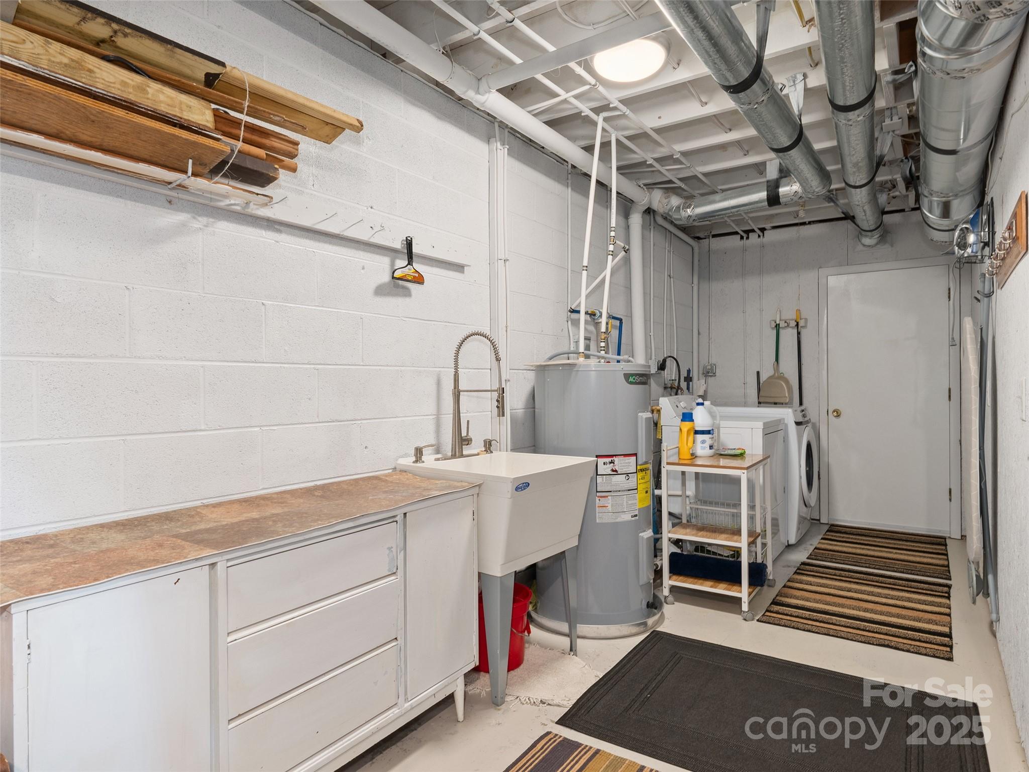 290 Turkey Pen Road Franklin, NC 28734 - Photo 29 of 37 a kitchen with a sink and cabinets
