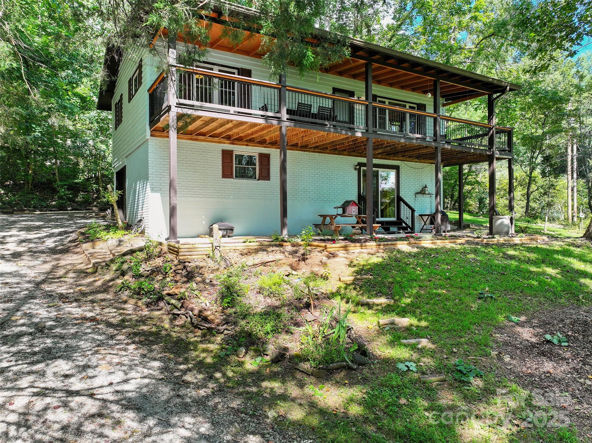 290 Turkey Pen Road Franklin, NC 28734 - Photo 3 of 37 a front view of a house with a yard