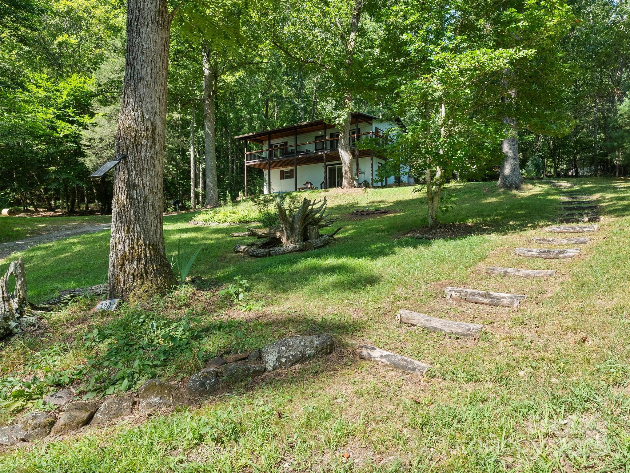 290 Turkey Pen Road Franklin, NC 28734 - Photo 34 of 37 front view of a house with a yard