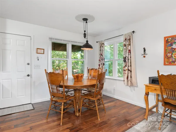 a dining room with furniture window wooden floor