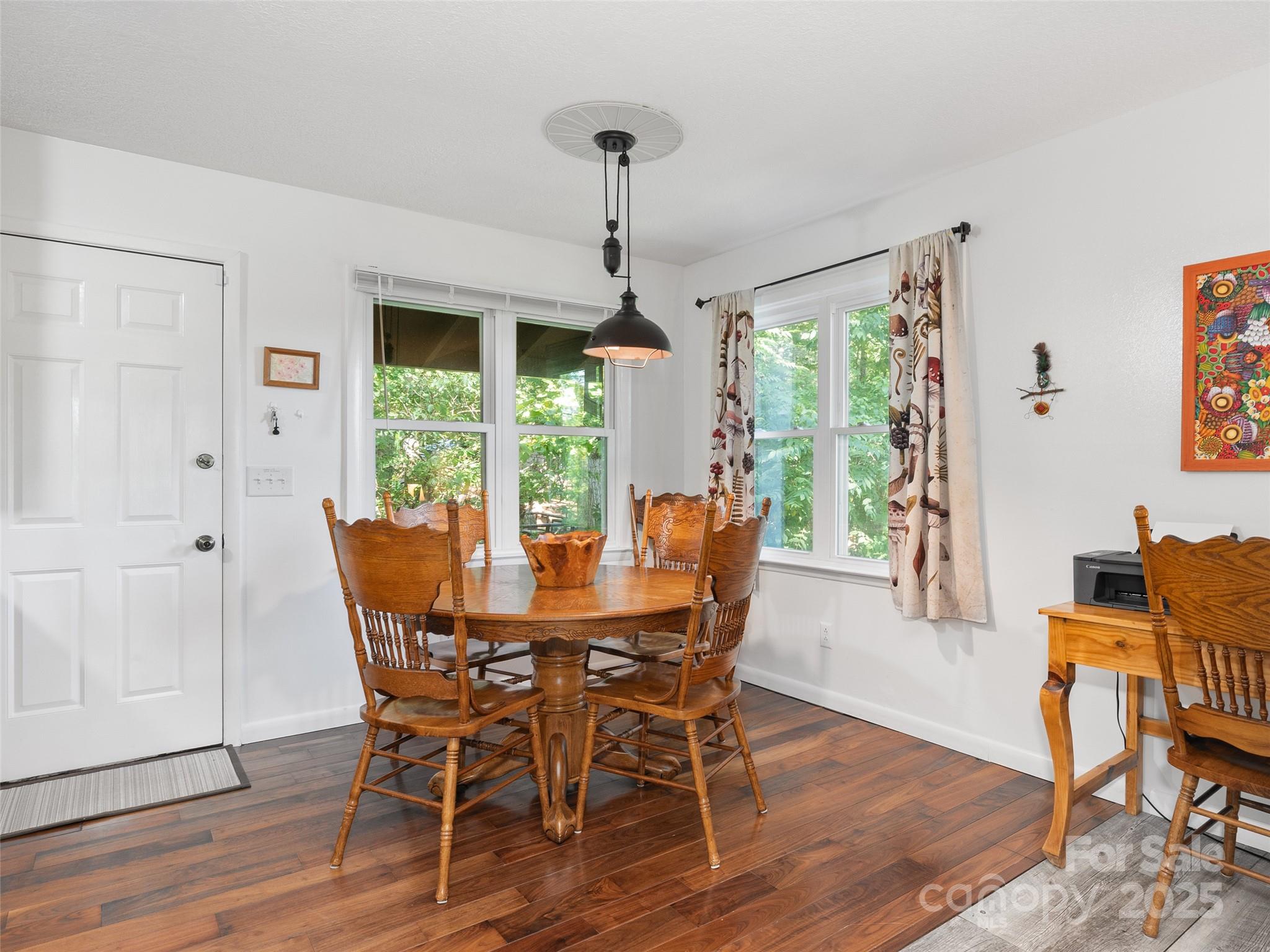 290 Turkey Pen Road Franklin, NC 28734 - Photo 6 of 37 a dining room with furniture window wooden floor