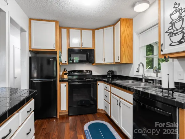a kitchen with a refrigerator stove and sink