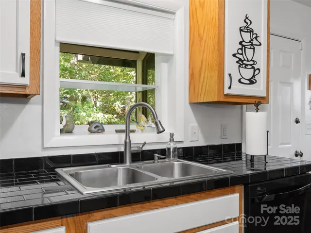 a kitchen with a sink and a window
