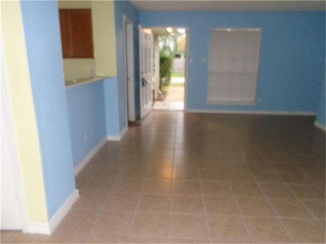 16714 Sinaloa Drive Houston, TX 77083 - Photo 3 of 10 a view of a hallway with wooden floor and a window