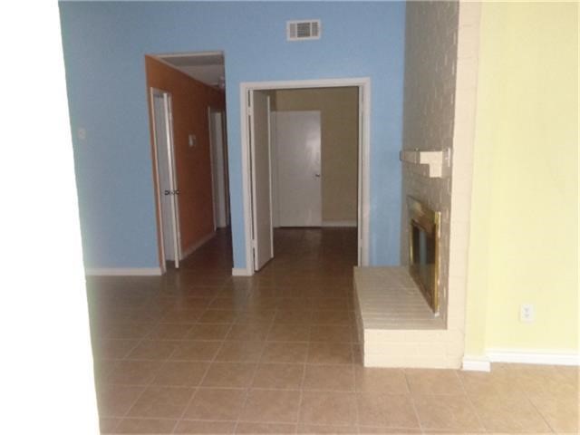 16714 Sinaloa Drive Houston, TX 77083 - Photo 4 of 10 a view of a hallway with wooden floor