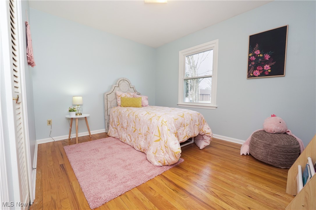2674 Smith Road Fairlawn, OH 44333 - Photo 21 of 31 Bedroom with baseboards and wood finished floors