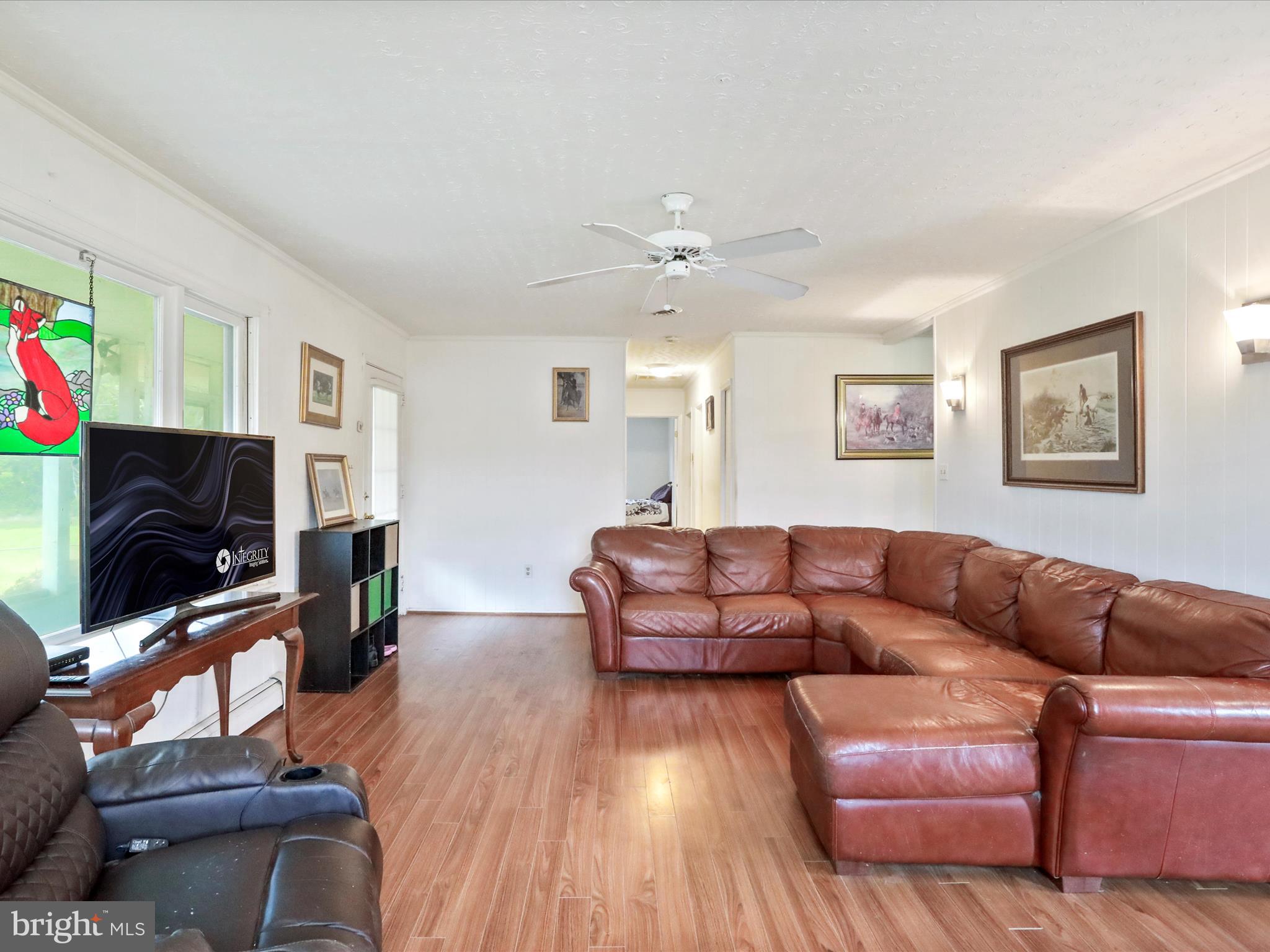 903 Coverstone Road Fort Valley, VA 22652 - Photo 13 of 75 a living room with furniture flat screen tv and wooden floor