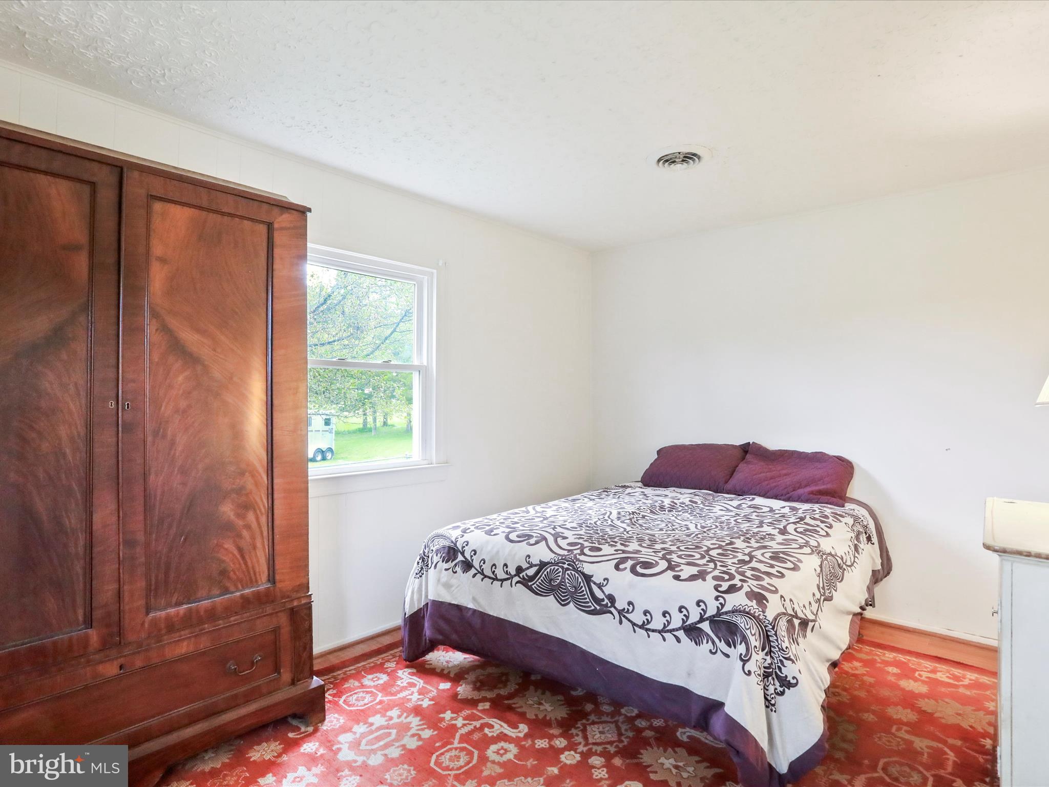 903 Coverstone Road Fort Valley, VA 22652 - Photo 23 of 75 a bedroom with a bed and a window