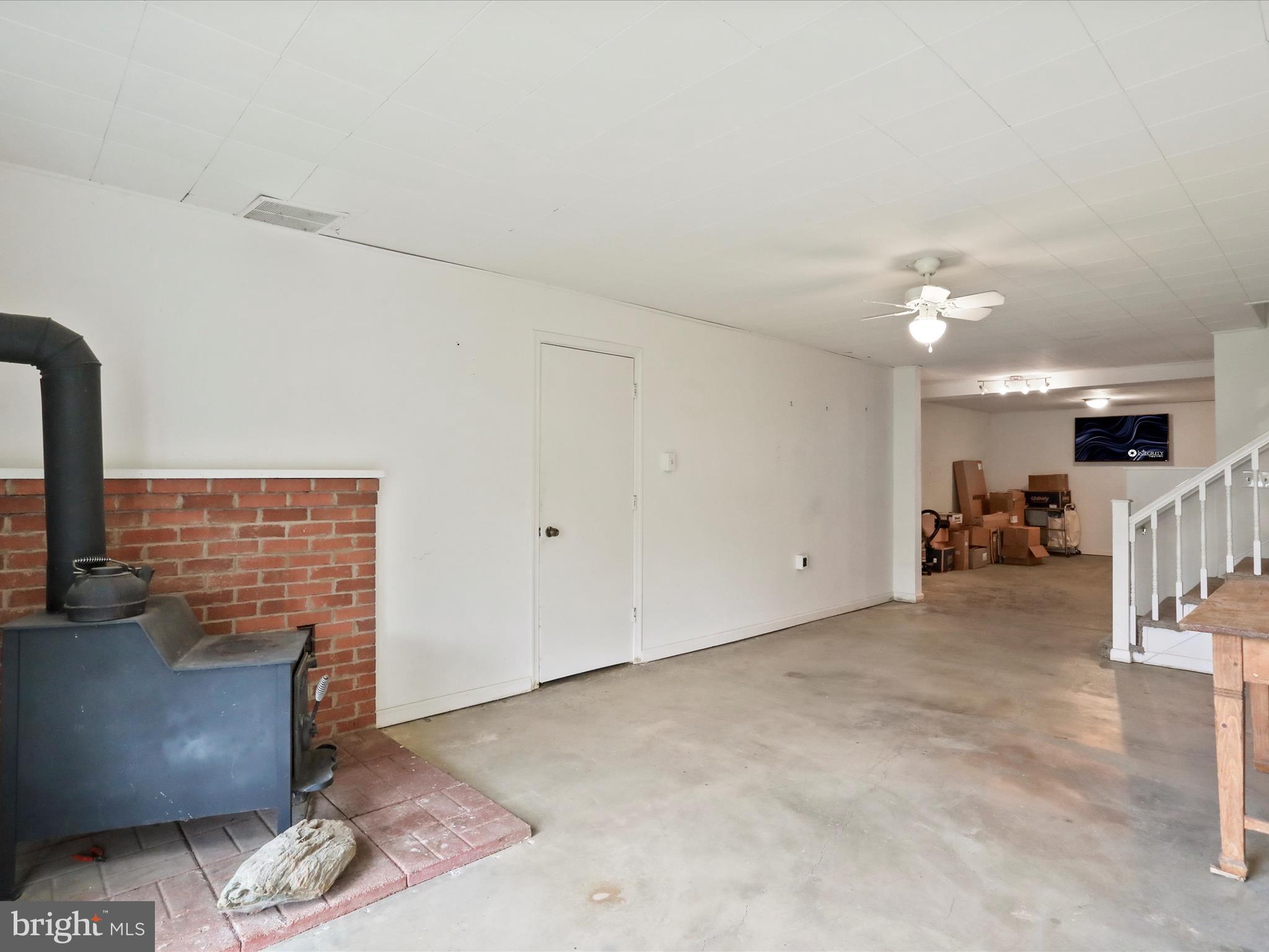 903 Coverstone Road Fort Valley, VA 22652 - Photo 27 of 75 a living room with furniture and a fireplace