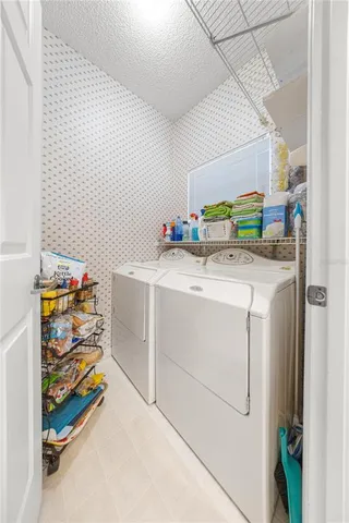 a utility room with washer and dryer