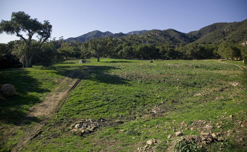 975 Hot Springs Road Montecito, CA 93108 - Photo 3 of 10 a view of a grassy field with mountains in the background