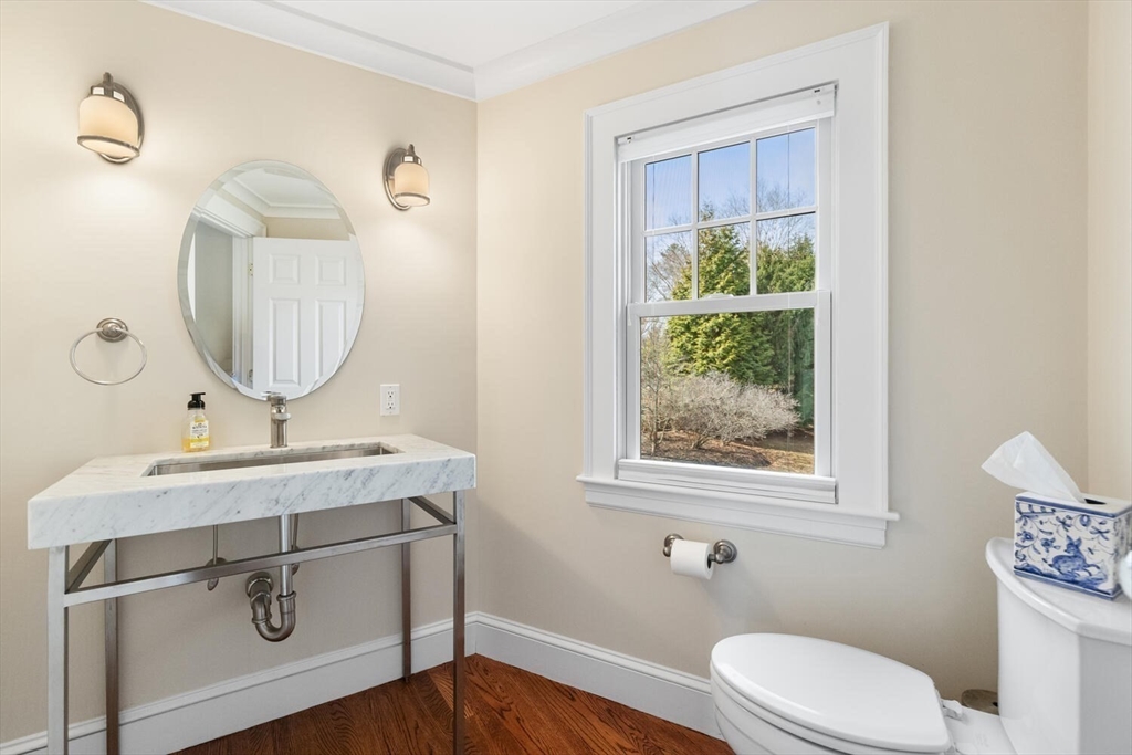 209 Waltham Street Lexington, MA 02421 - Photo 24 of 39 a bathroom with a granite countertop toilet sink and mirror