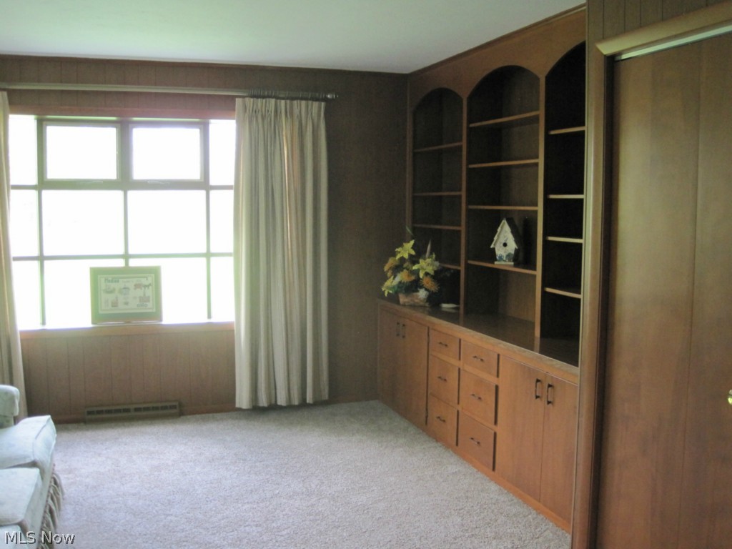 683 East Smith Road Medina, OH 44256 - Photo 6 of 25 Family Room is 15 X 11 and features bow window and built in bookcases and two closets.