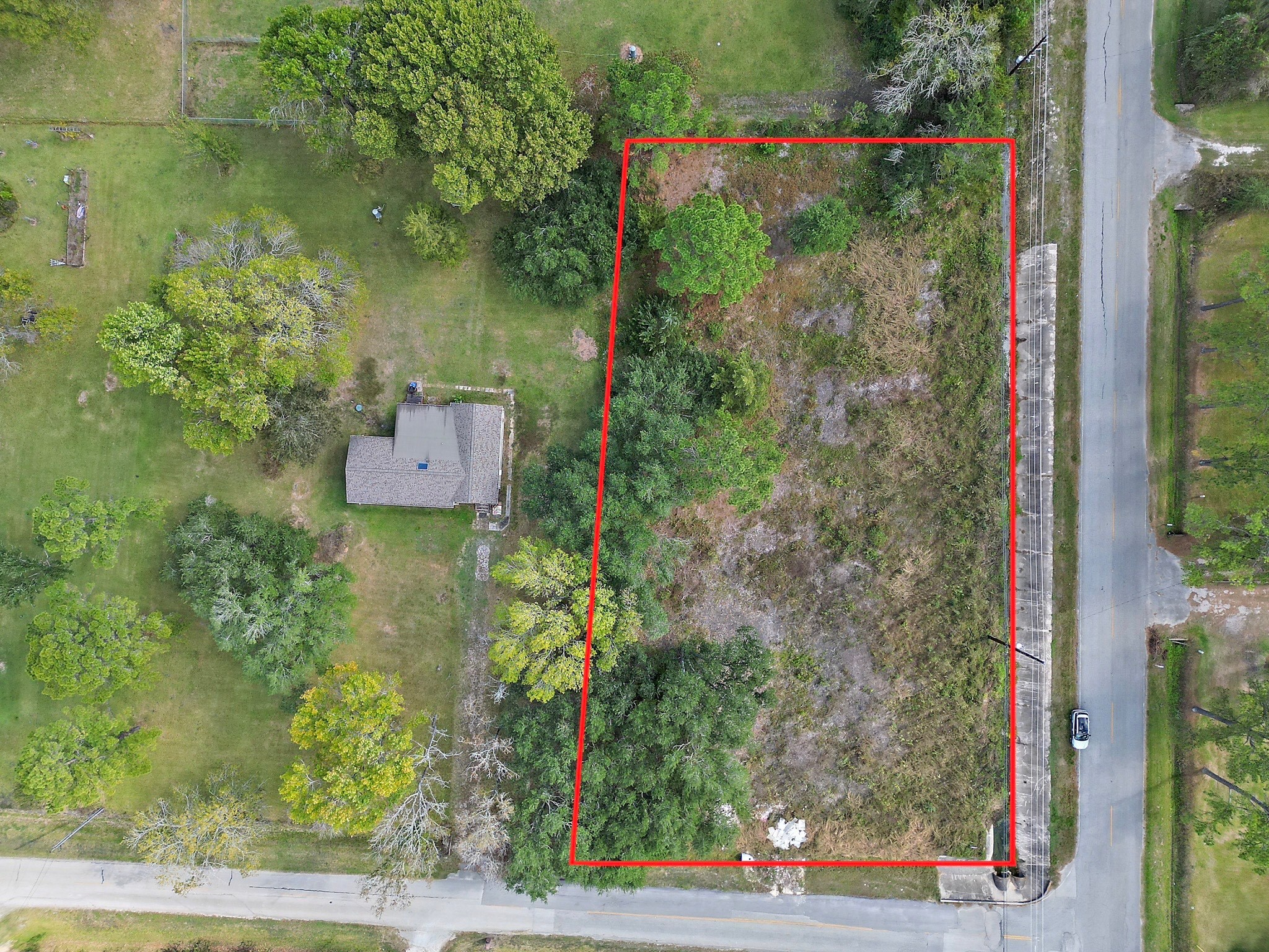 an aerial view of a house with yard