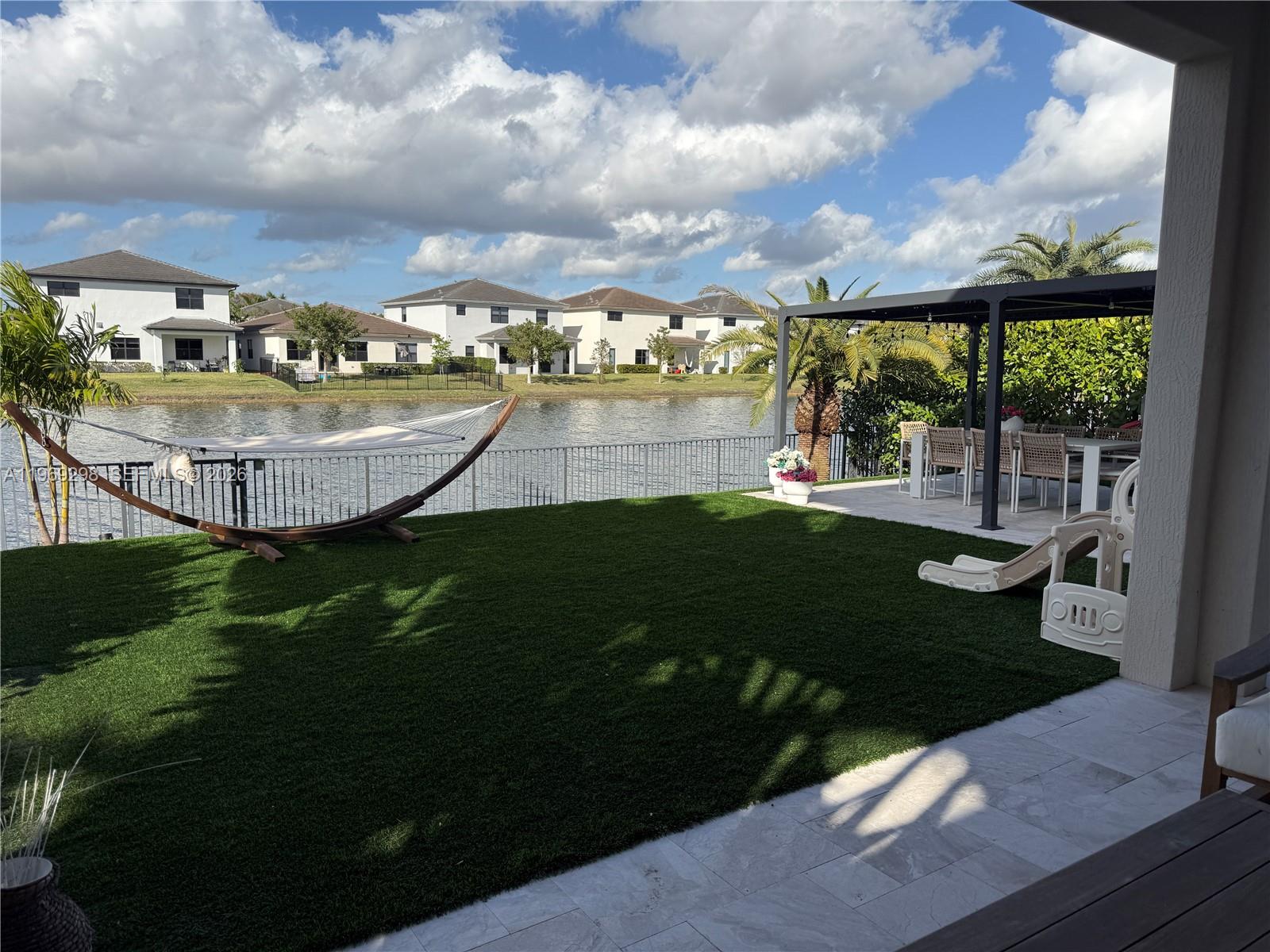 17507 Southwest 43rd Street Miramar, FL 33029 - Photo 13 of 25 a view of a swimming pool with a garden