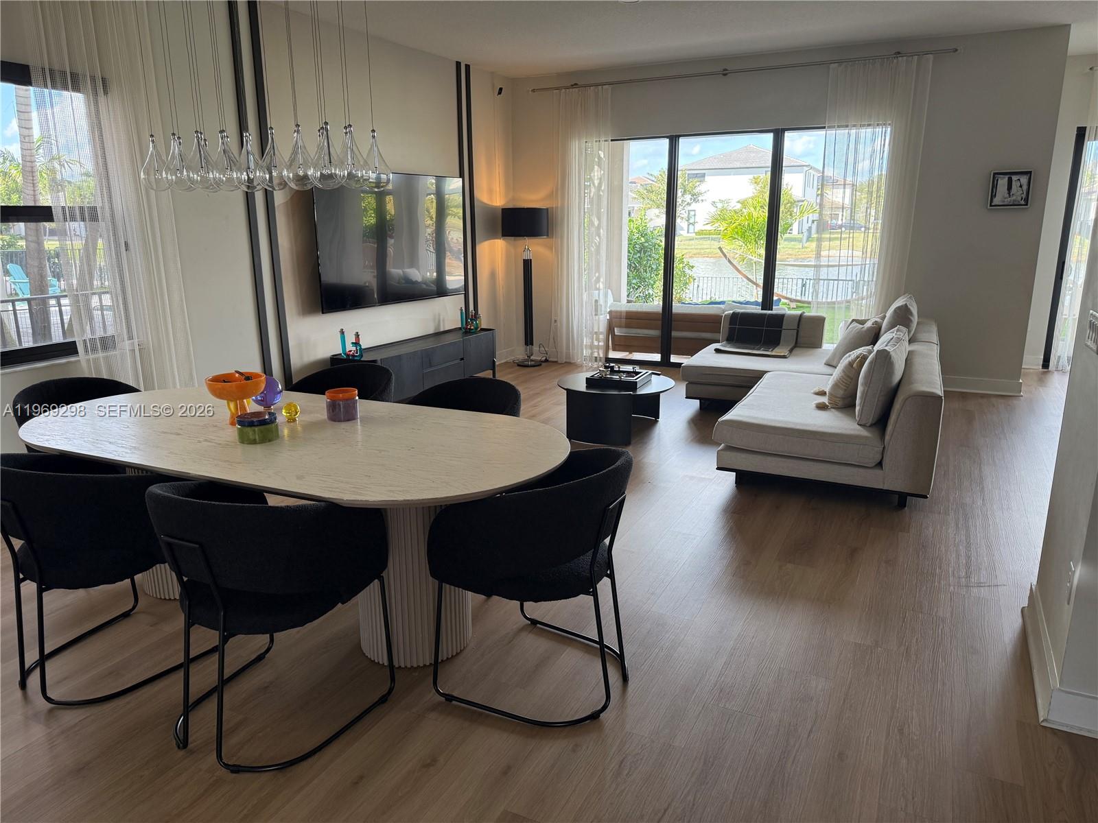17507 Southwest 43rd Street Miramar, FL 33029 - Photo 15 of 25 a living room with furniture and a flat screen tv