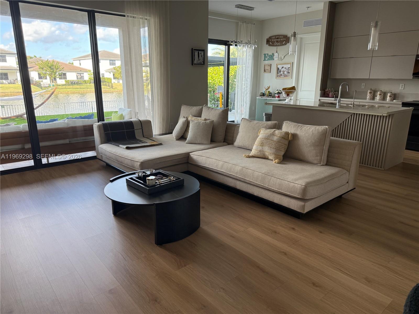 17507 Southwest 43rd Street Miramar, FL 33029 - Photo 16 of 25 a living room with furniture and a large window