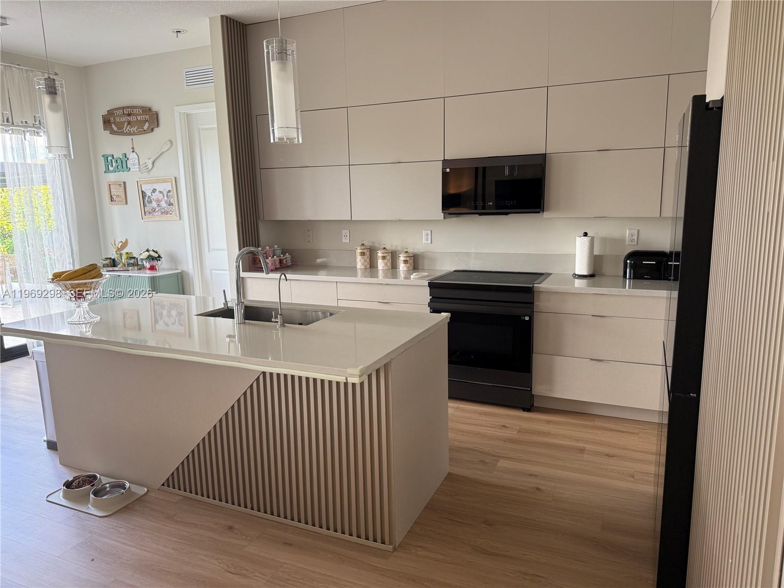 17507 Southwest 43rd Street Miramar, FL 33029 - Photo 17 of 25 a kitchen with a sink cabinets and appliances