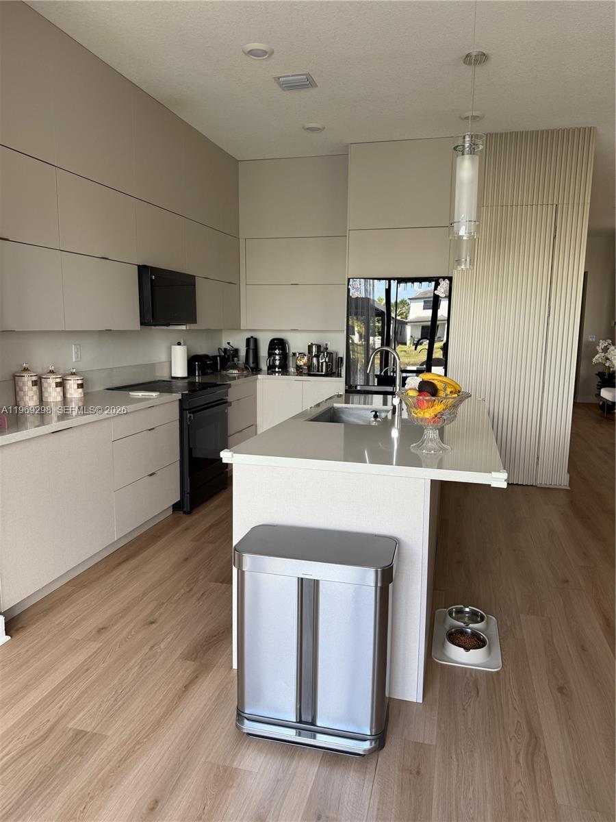 17507 Southwest 43rd Street Miramar, FL 33029 - Photo 20 of 25 a kitchen with a sink appliances and cabinets