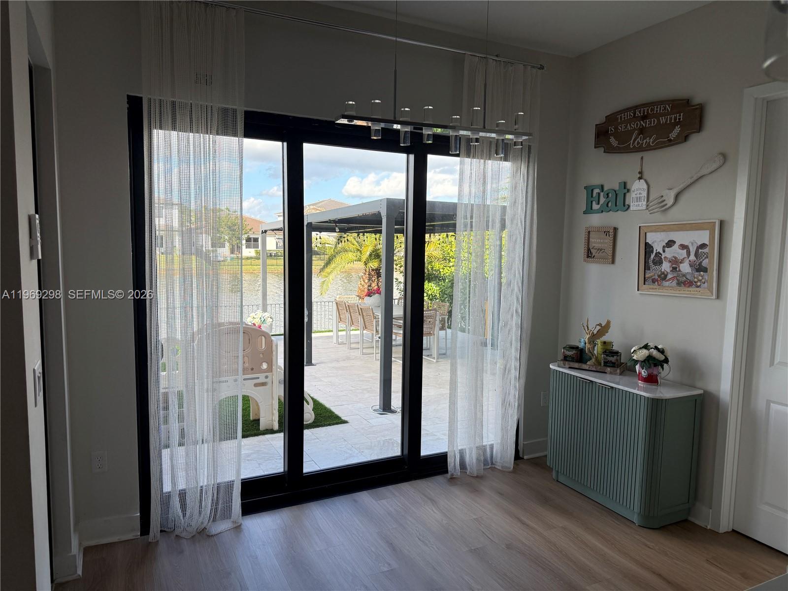 17507 Southwest 43rd Street Miramar, FL 33029 - Photo 21 of 25 a view of an empty room with wooden floor and a floor to ceiling window