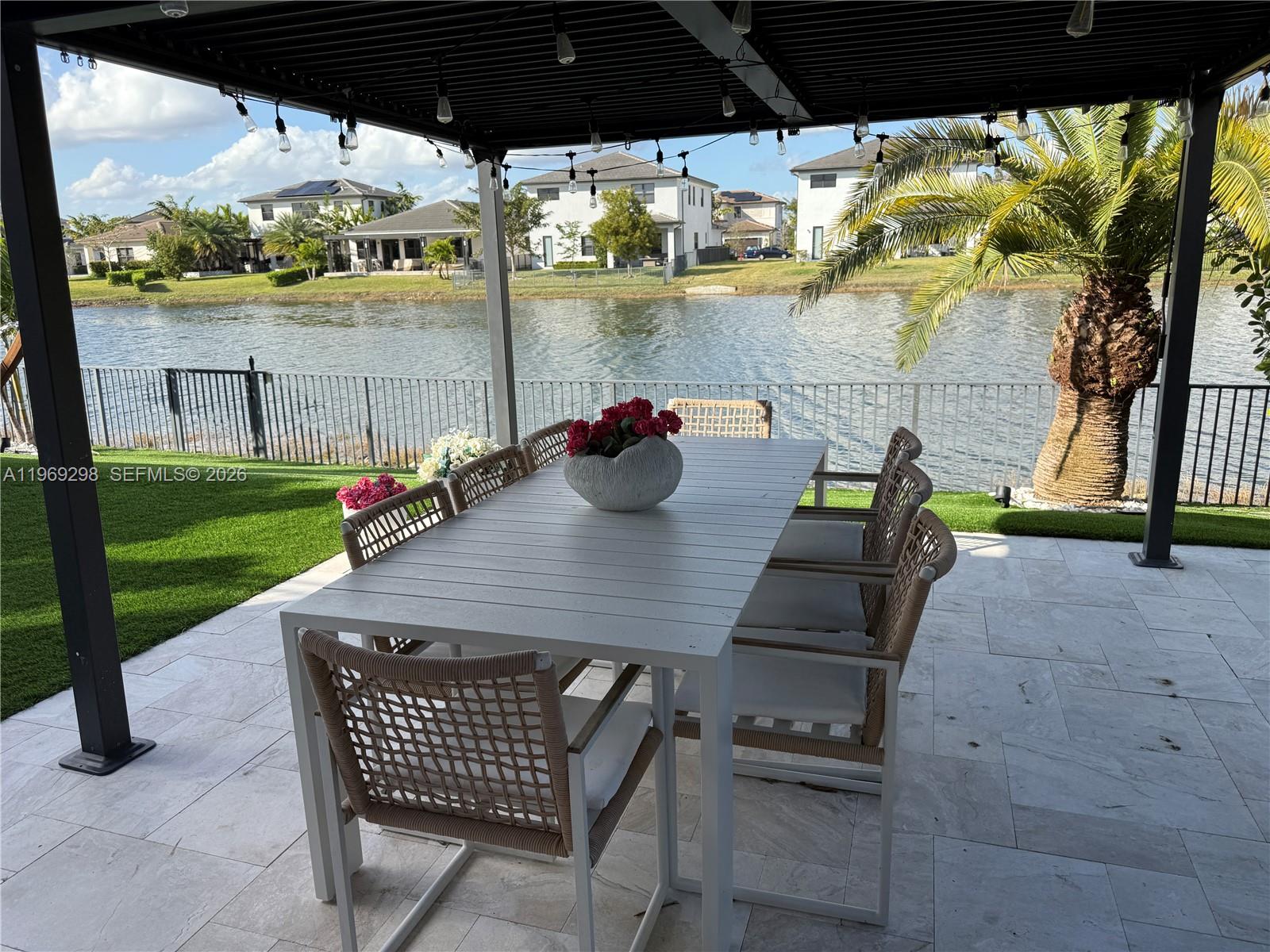 17507 Southwest 43rd Street Miramar, FL 33029 - Photo 24 of 25 a view of a patio with table and chairs and potted plants