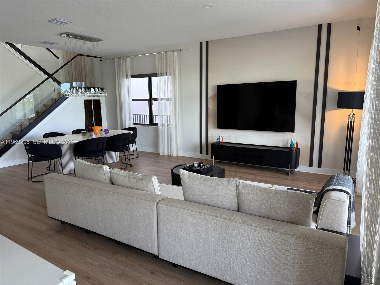 17507 Southwest 43rd Street Miramar, FL 33029 - Photo 4 of 25 a living room with furniture and a flat screen tv