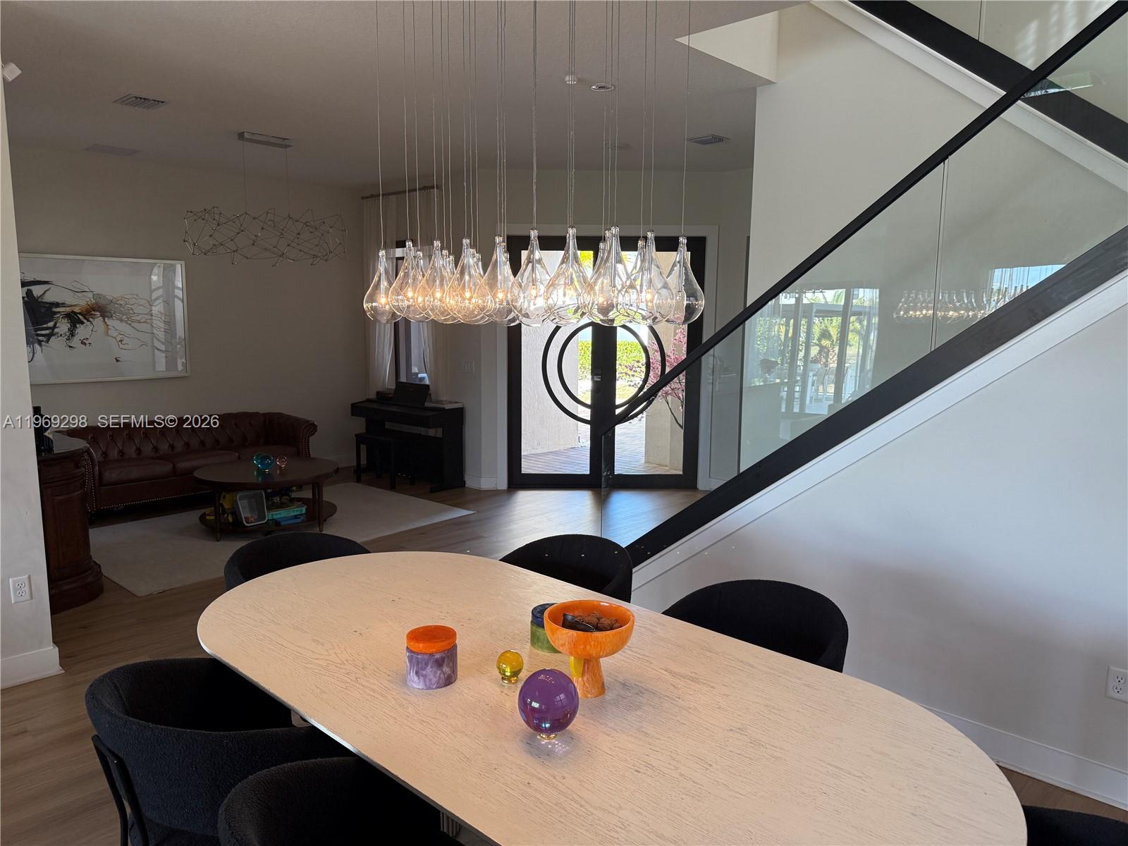 17507 Southwest 43rd Street Miramar, FL 33029 - Photo 6 of 25 a living room with furniture and chandelier