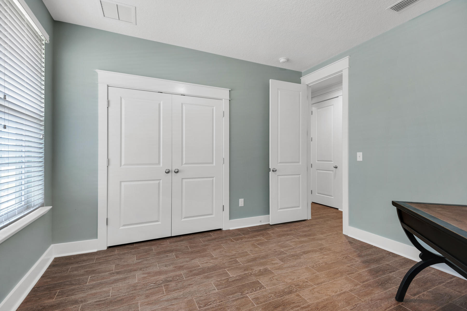 213 Blue Sage Road Panama City Beach, FL 32413 - Photo 13 of 24 a view of an empty room and window