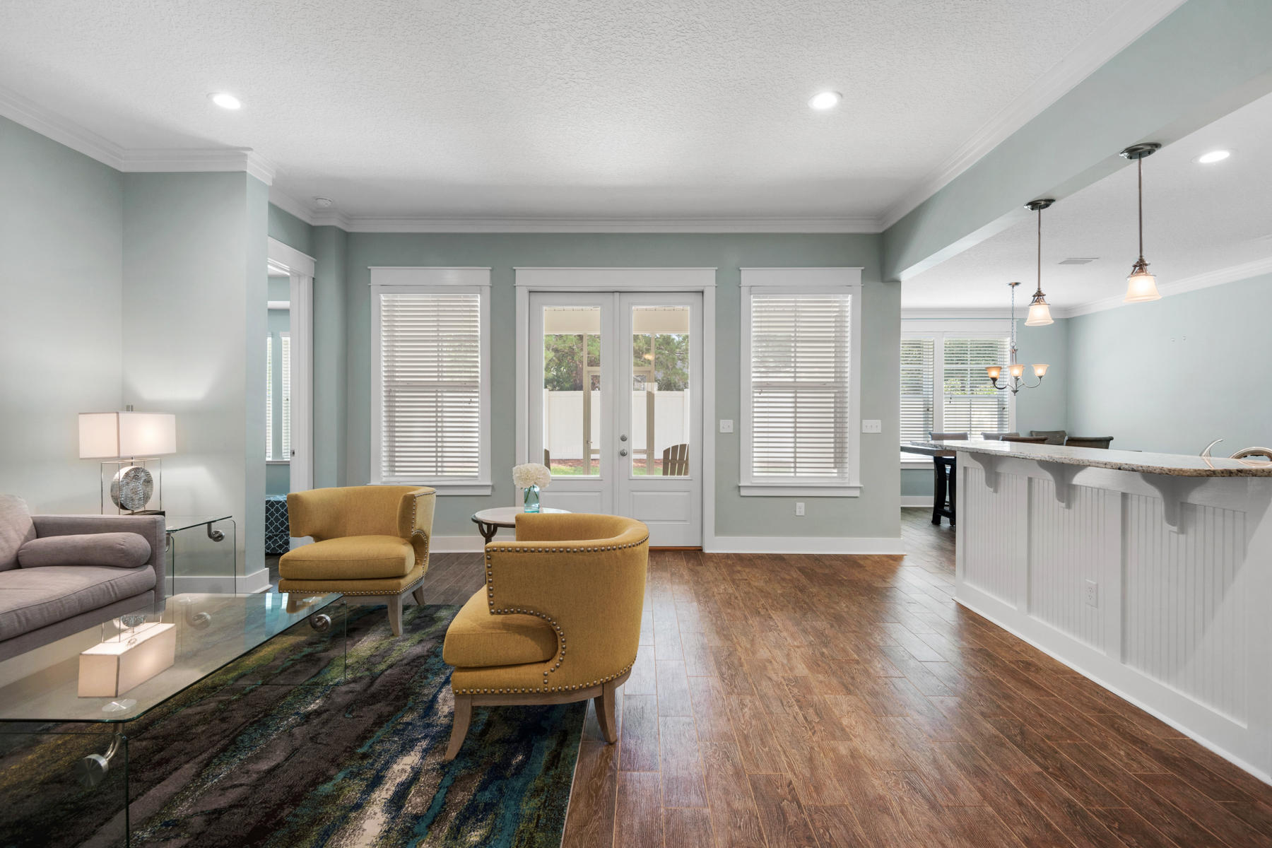 213 Blue Sage Road Panama City Beach, FL 32413 - Photo 6 of 24 a living room with furniture and a large window