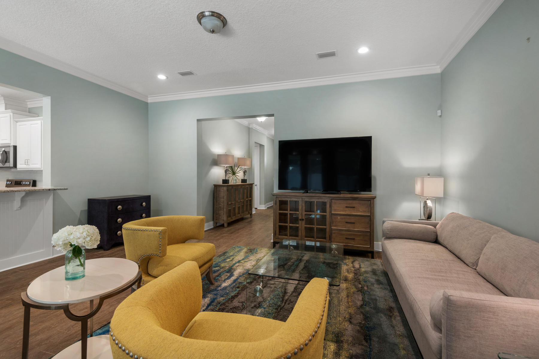 213 Blue Sage Road Panama City Beach, FL 32413 - Photo 7 of 24 a living room with furniture and a flat screen tv