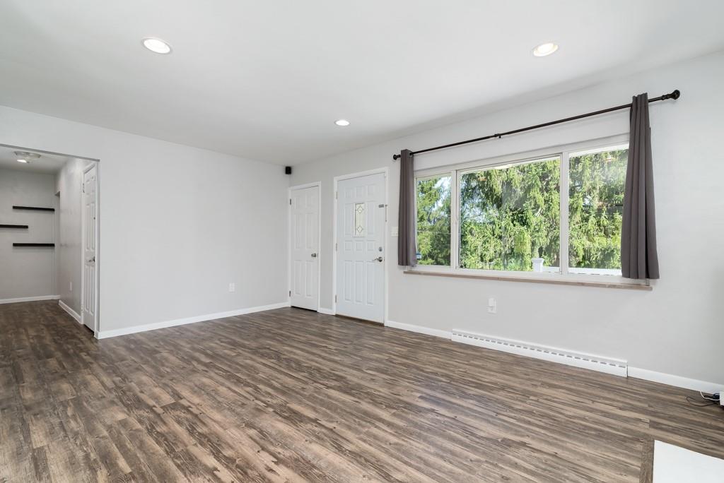 109 Brownsdale Road Butler, PA 16002 - Photo 13 of 26 a view of an empty room with wooden floor and a window