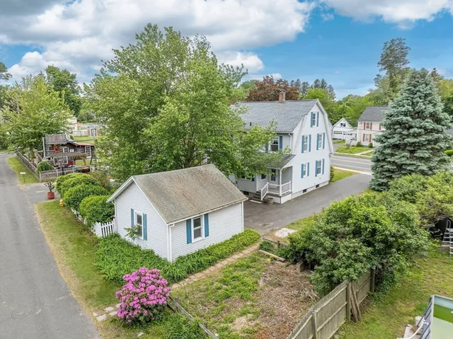 a view of a room with wooden floor and a window