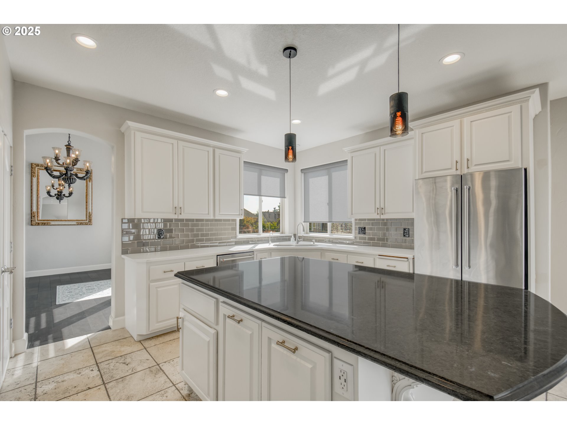4907 Northwest Highpoint Drive Camas, WA 98607 - Photo 11 of 48 a kitchen with stainless steel appliances granite countertop a sink a stove and refrigerator