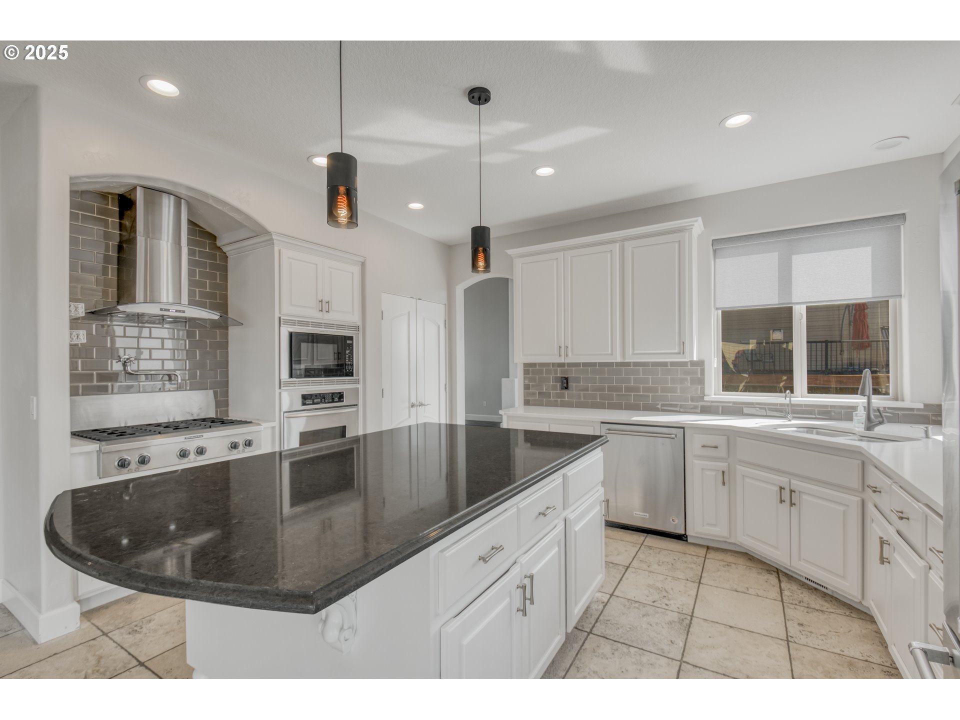 4907 Northwest Highpoint Drive Camas, WA 98607 - Photo 12 of 48 a kitchen with sink stove and refrigerator