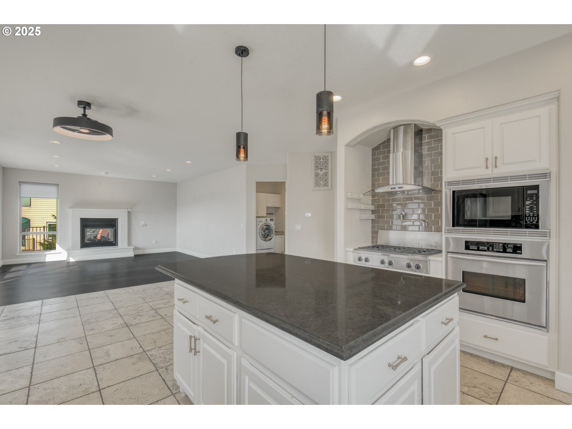 4907 Northwest Highpoint Drive Camas, WA 98607 - Photo 13 of 48 a kitchen with stainless steel appliances granite countertop a sink a stove and a refrigerator
