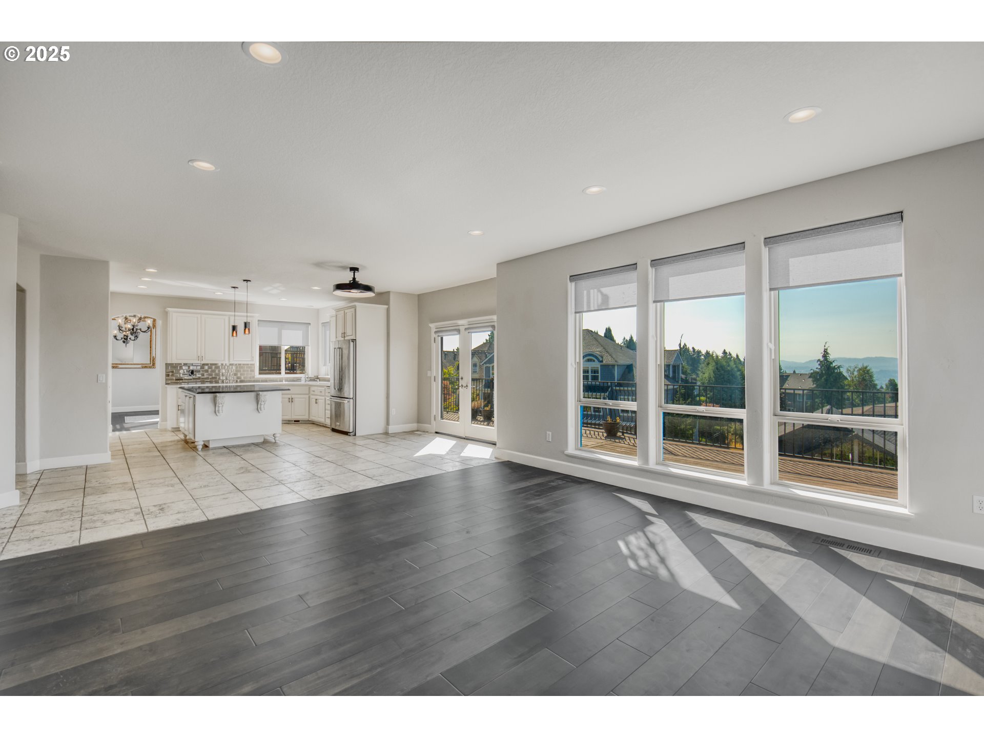 4907 Northwest Highpoint Drive Camas, WA 98607 - Photo 14 of 48 a view of an empty room with wooden floor and a window