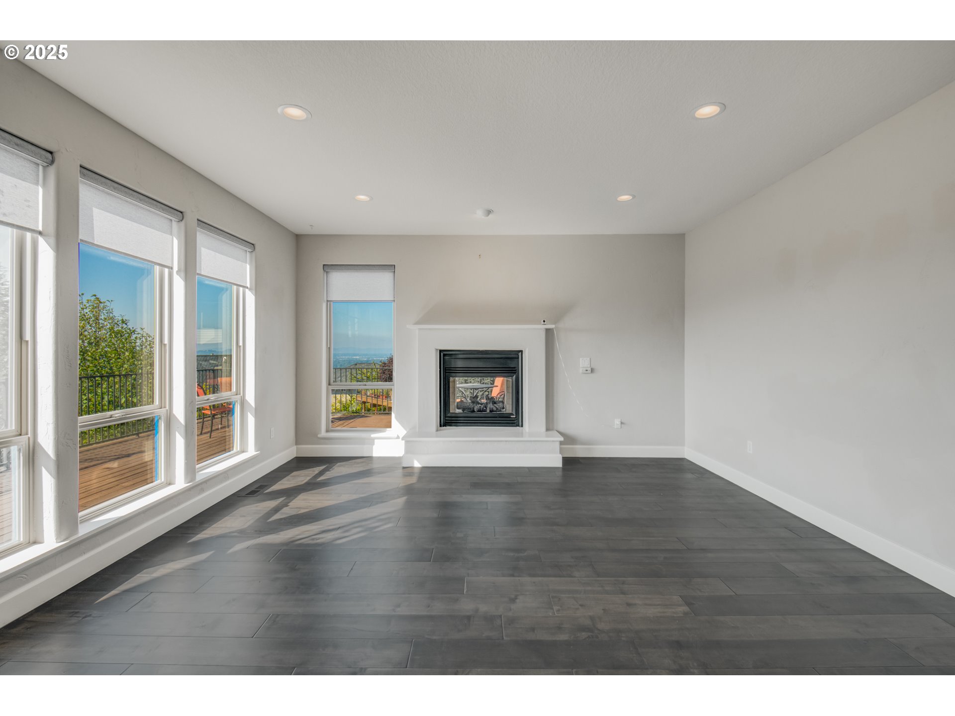 4907 Northwest Highpoint Drive Camas, WA 98607 - Photo 15 of 48 a view of an empty room with wooden floor and a window