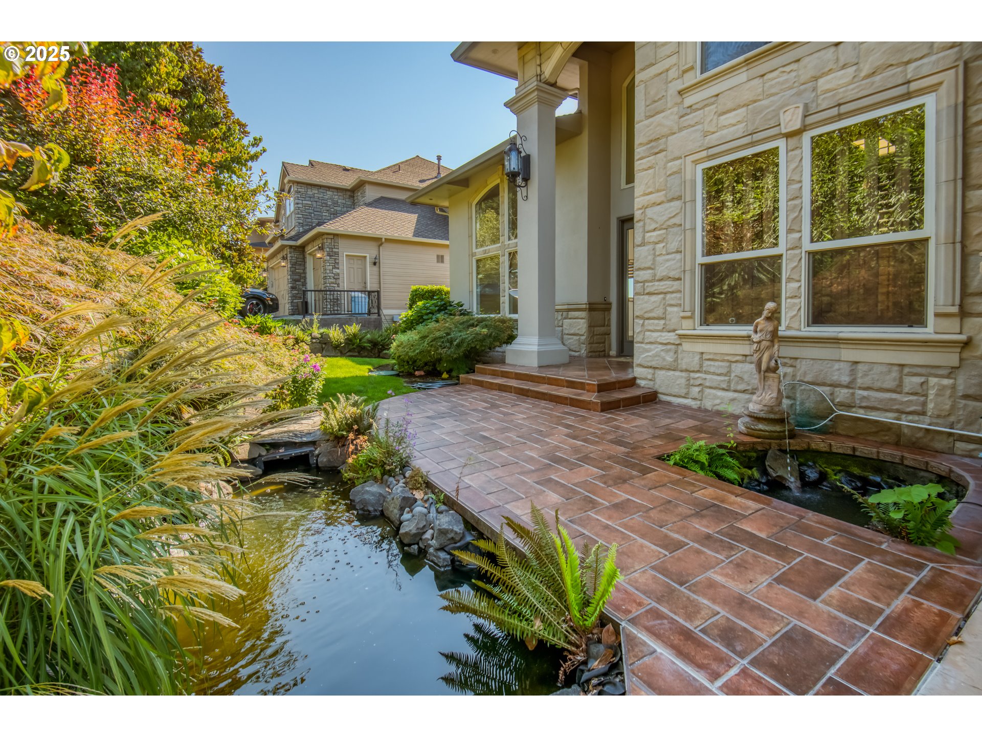 4907 Northwest Highpoint Drive Camas, WA 98607 - Photo 2 of 48 a front view of a house with a garden