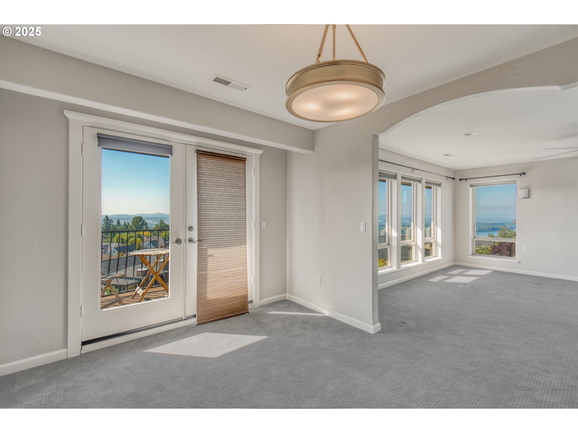 4907 Northwest Highpoint Drive Camas, WA 98607 - Photo 24 of 48 a view interior of a house wooden floor and chandelier