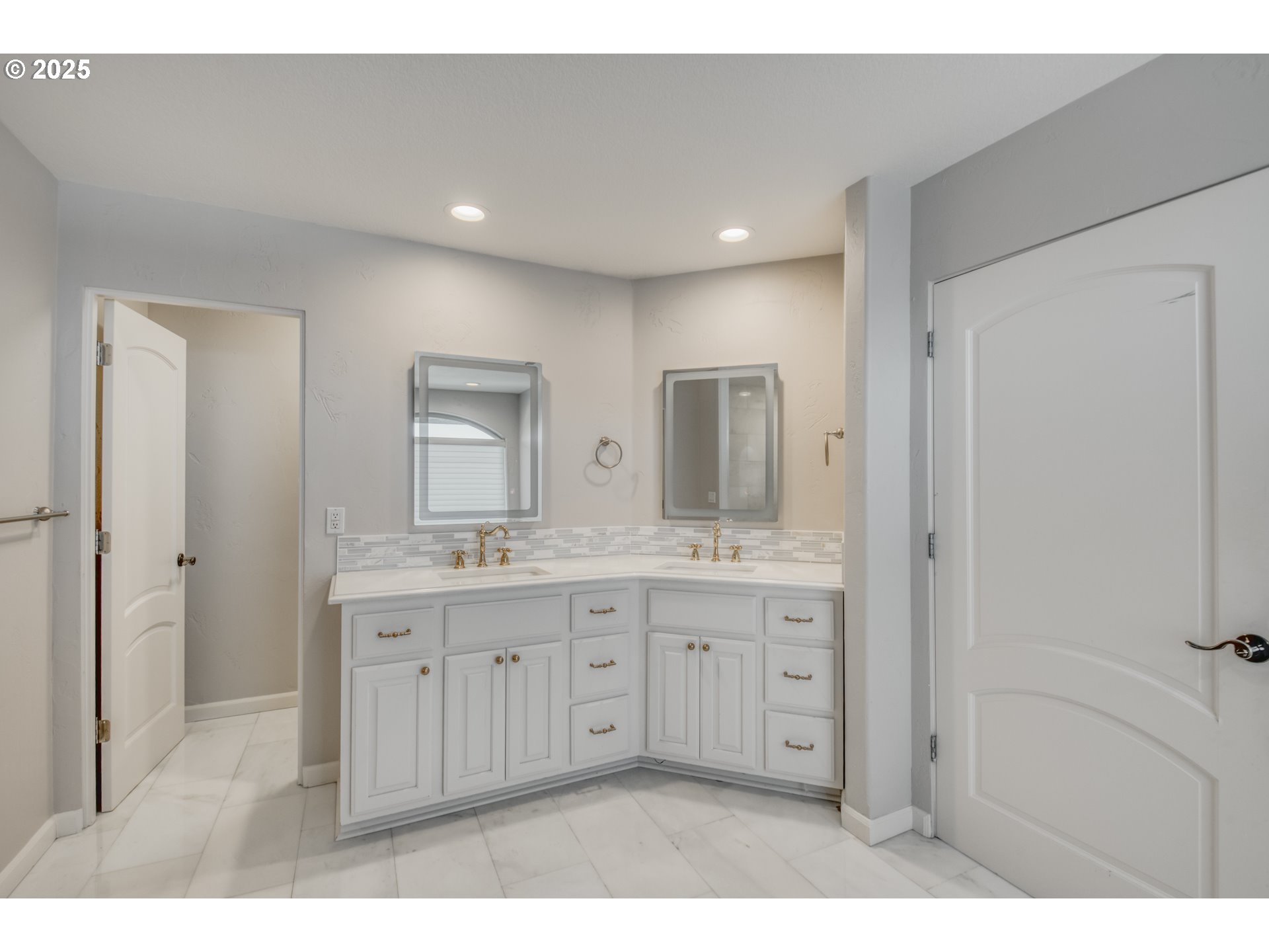 4907 Northwest Highpoint Drive Camas, WA 98607 - Photo 26 of 48 a bathroom with a granite countertop sink two mirror and a