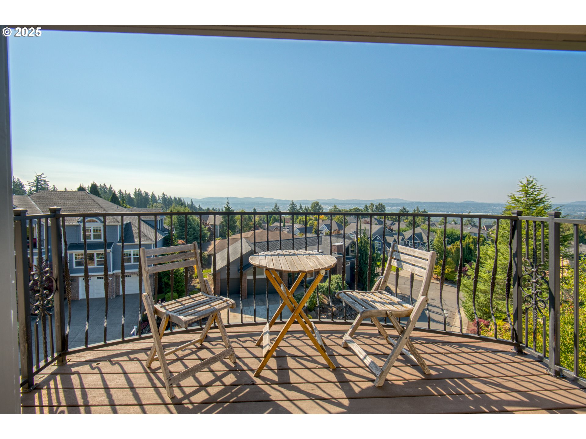 4907 Northwest Highpoint Drive Camas, WA 98607 - Photo 28 of 48 a view of a balcony with chairs and wooden floor