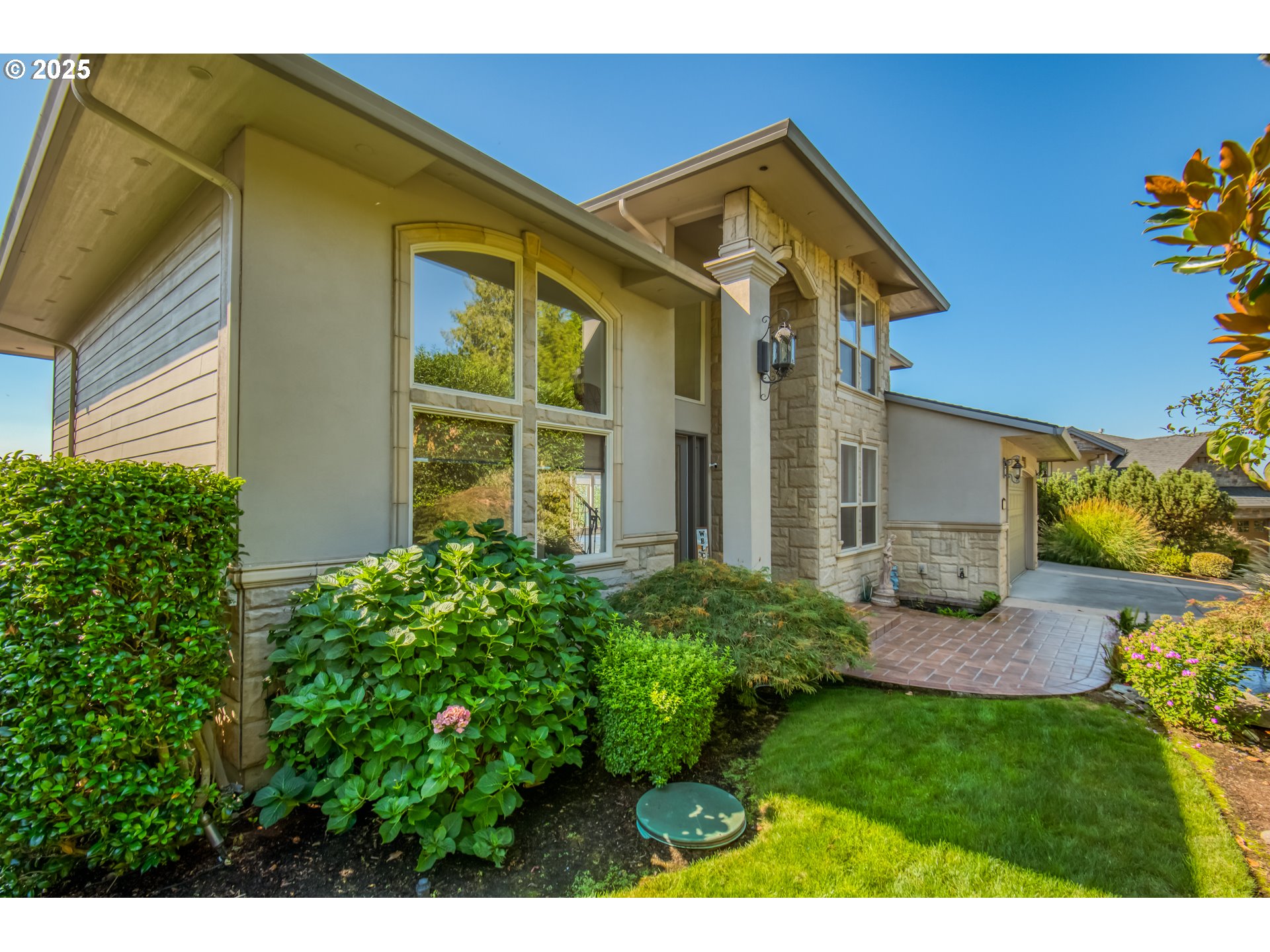 4907 Northwest Highpoint Drive Camas, WA 98607 - Photo 3 of 48 a front view of a house with garden