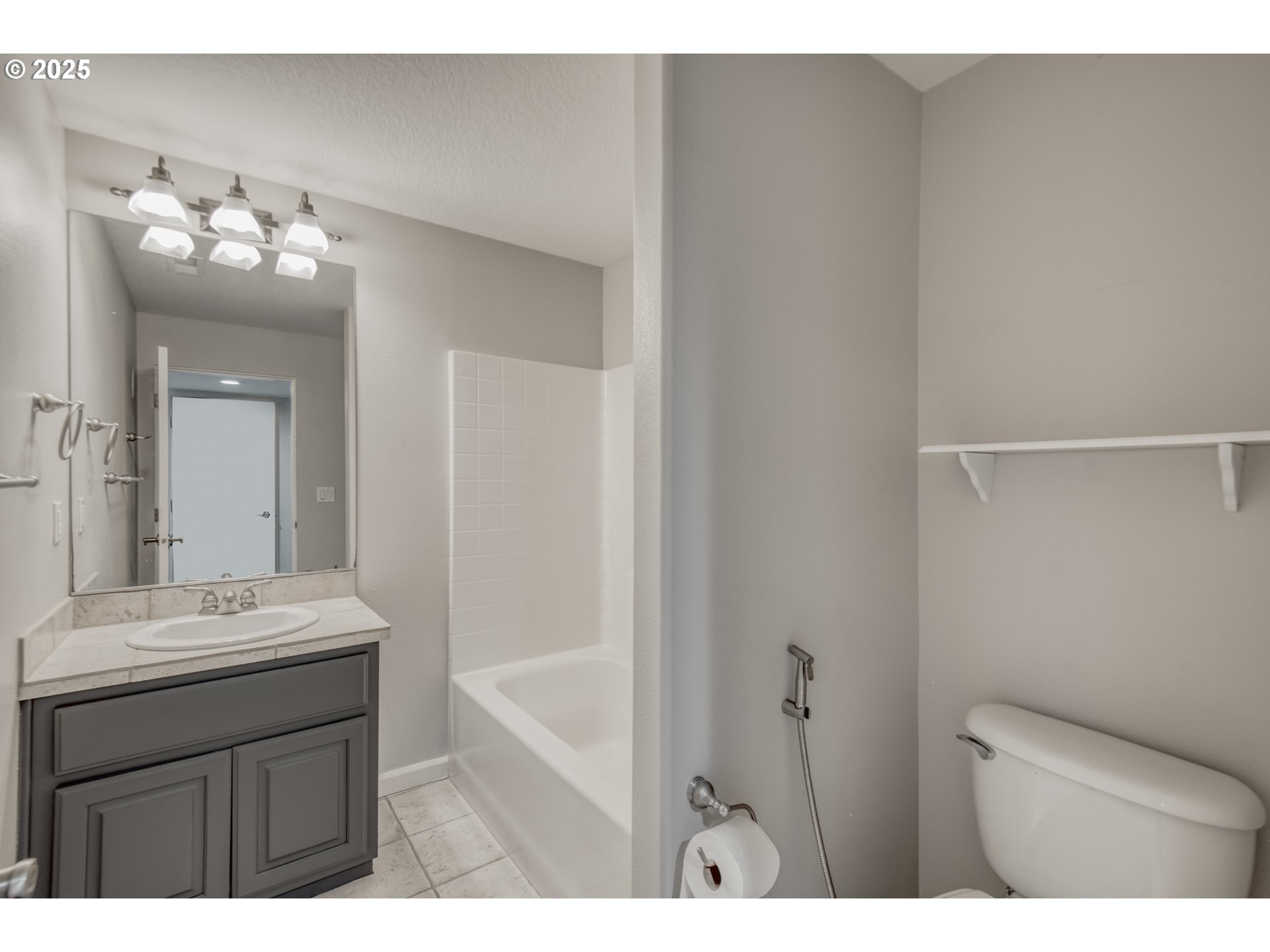 4907 Northwest Highpoint Drive Camas, WA 98607 - Photo 36 of 48 a bathroom with a sink mirror and a toilet