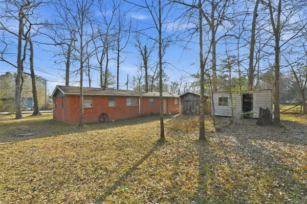a view of a backyard with trees