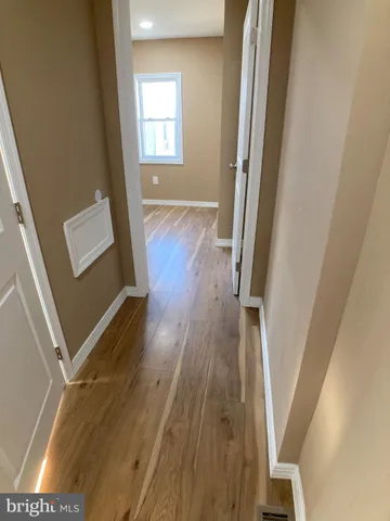 a bathroom with a toilet and a bath tub