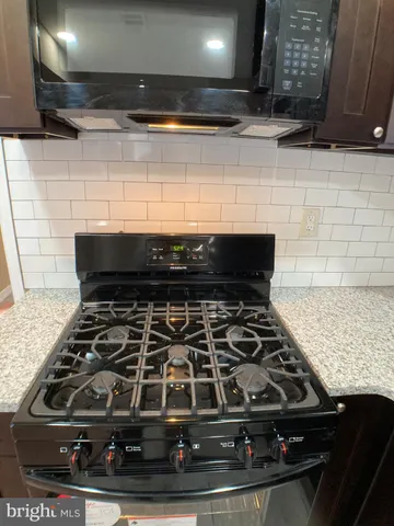 a view of a hallway with wooden shelves