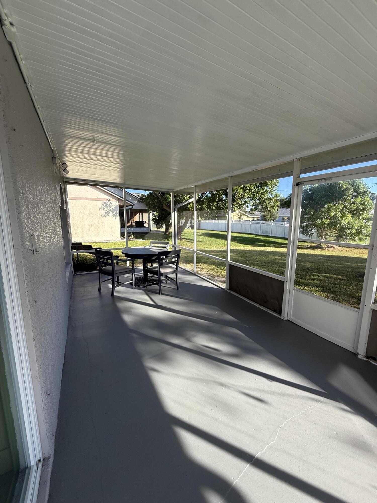 1925 Southwest Libra Lane Port St. Lucie, FL 34984 - Photo 22 of 49 a view of water heater room with wooden floor